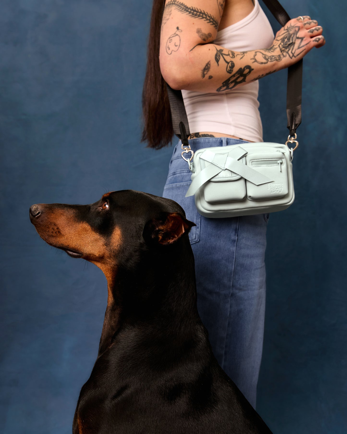 Light blue walking bag worn on shoulder.