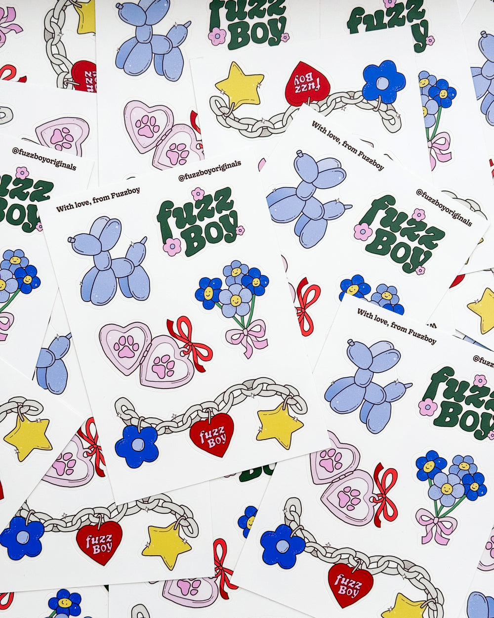 Sticker sheet with various designs including a blue balloon dog, Fuzzboy logo, bouquet of flowers, heart-shaped locket with pawprints, and a chain with charms.
